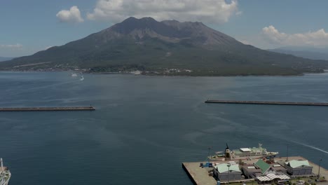 aerial tilt reveals sakurajima and kagoshima bay in japan on clear day