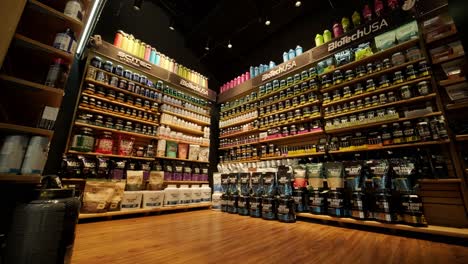 sport nutrition store interior with large choice of nutritional supplements.