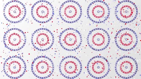 confetti falling over multiple stars on spinning circles against grey background