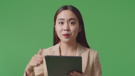 woman pointing at tablet