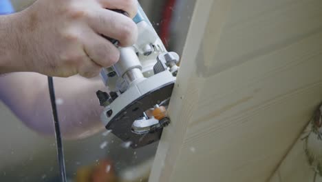 Slow-Motion-Shot-Of-Hand-Cutting-Wood-Carefully