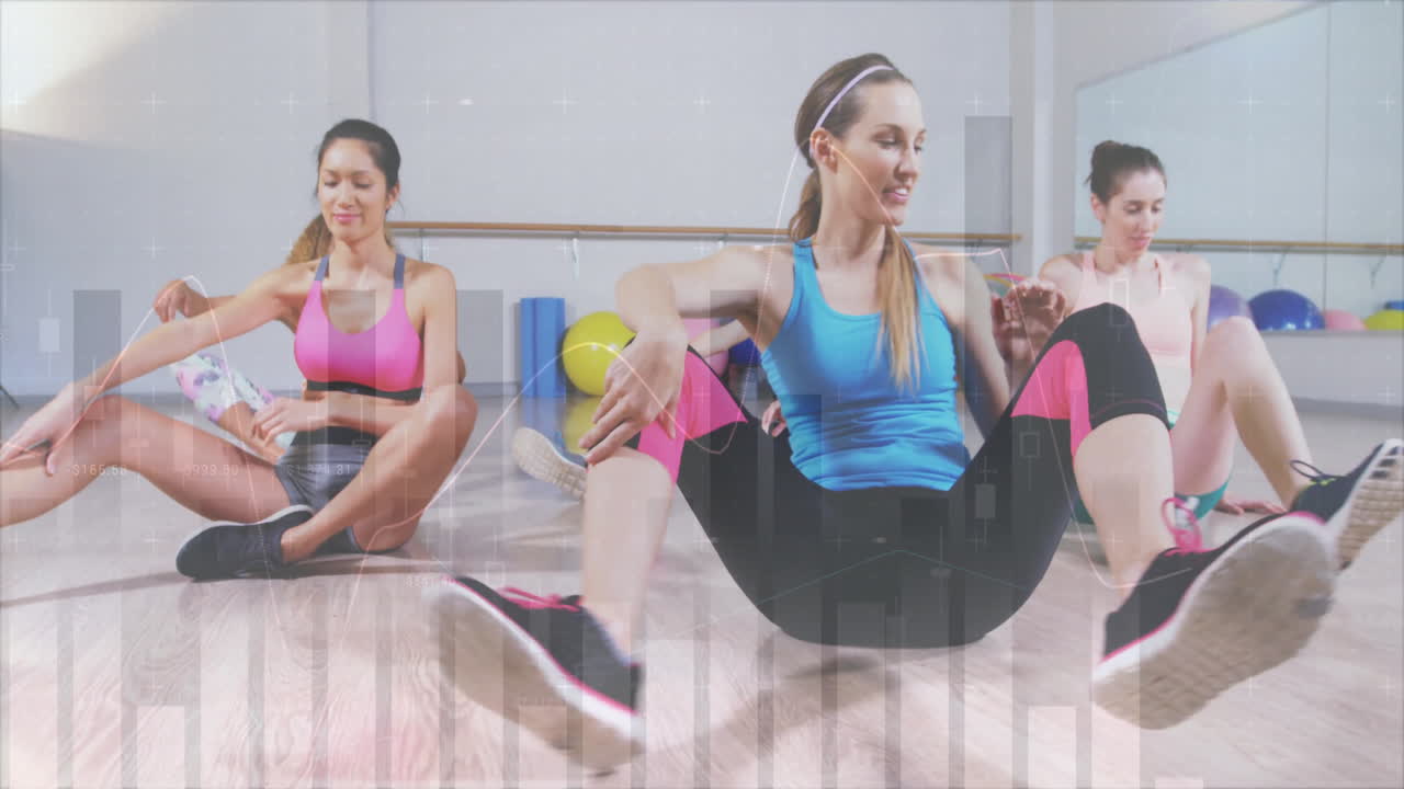Three women doing seated stretch in fitness studio, with animated heart icon and flexibility meter