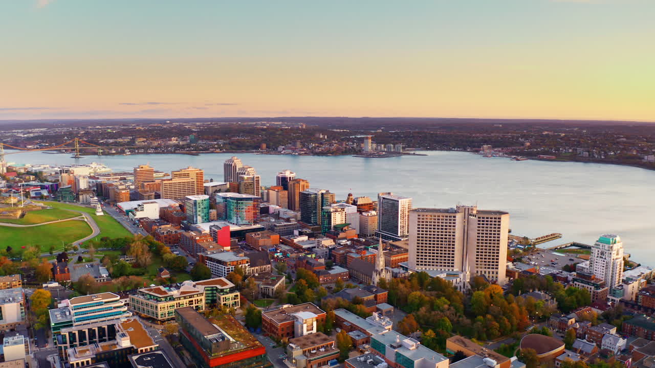 Aerial drone shot over Halifax downtown, Nova Scotia, Canada.
High view of the cityscape, ocean and the urban buildings.