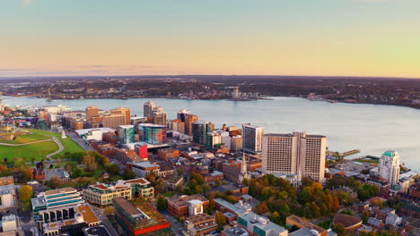 aerial drone shot over halifax downtown, nova scotia, canada.
high view of the cityscape, ocean and the urban buildings.