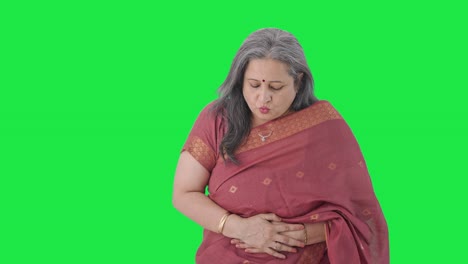 Sick-Indian-old-woman-suffering-from-stomach-pain-Green-screen