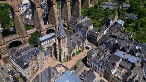 smooth tilted panning drone movement near the gothic saint-melaine church and the railway bridge like a roman viaduct in morlaix, brittany, france.