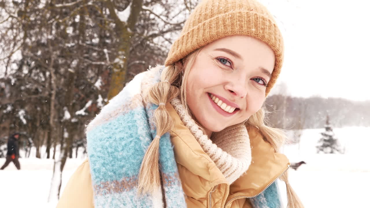 Woman Smiling in a Snowy Park