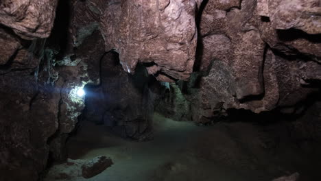 the movement of the camera through a very dark tunnel into the darkness the movement of the camera through a very dark tunnel into the darkness speleology a cave a dungeon