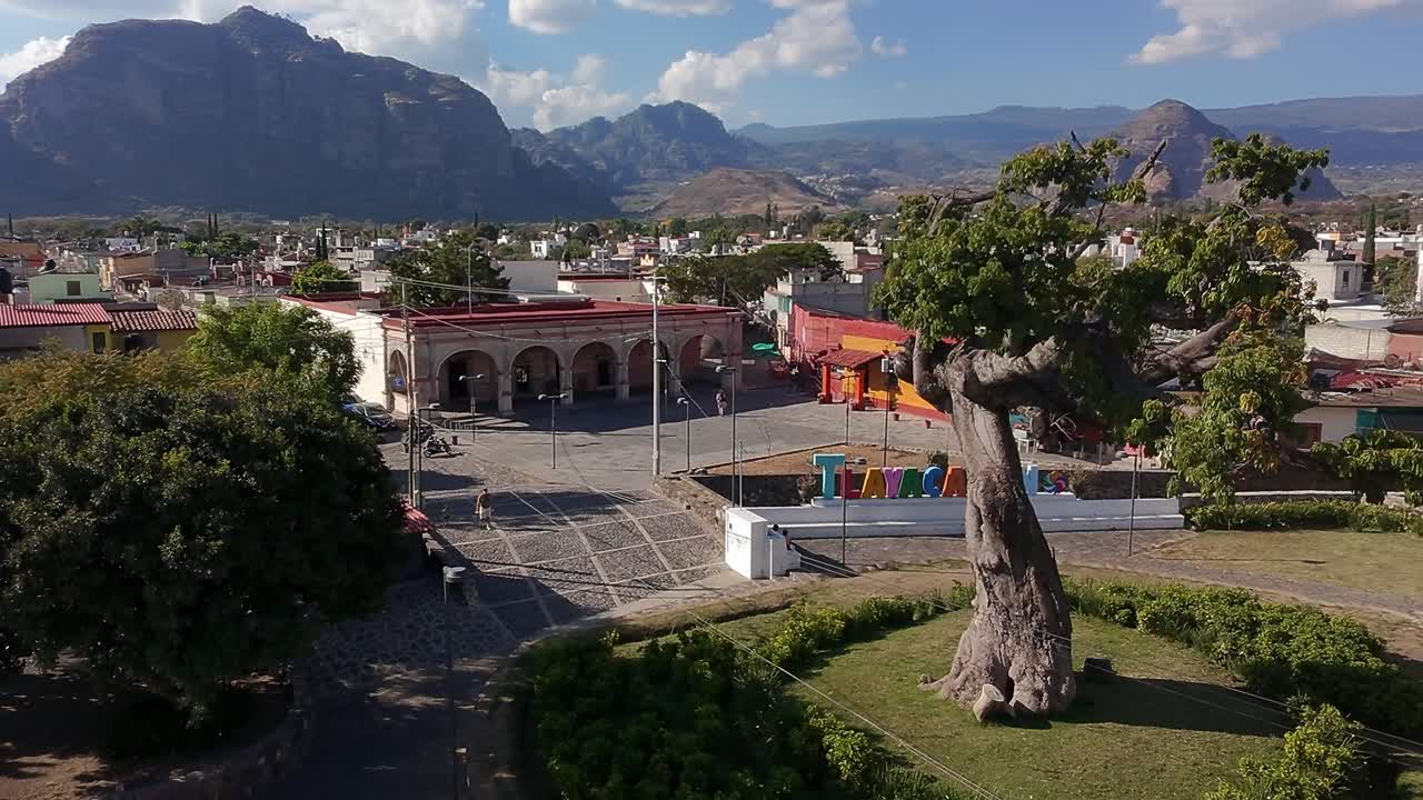 Scenic view of a town in Morelos, with a message from Rhea Chaudhary discussing tasks