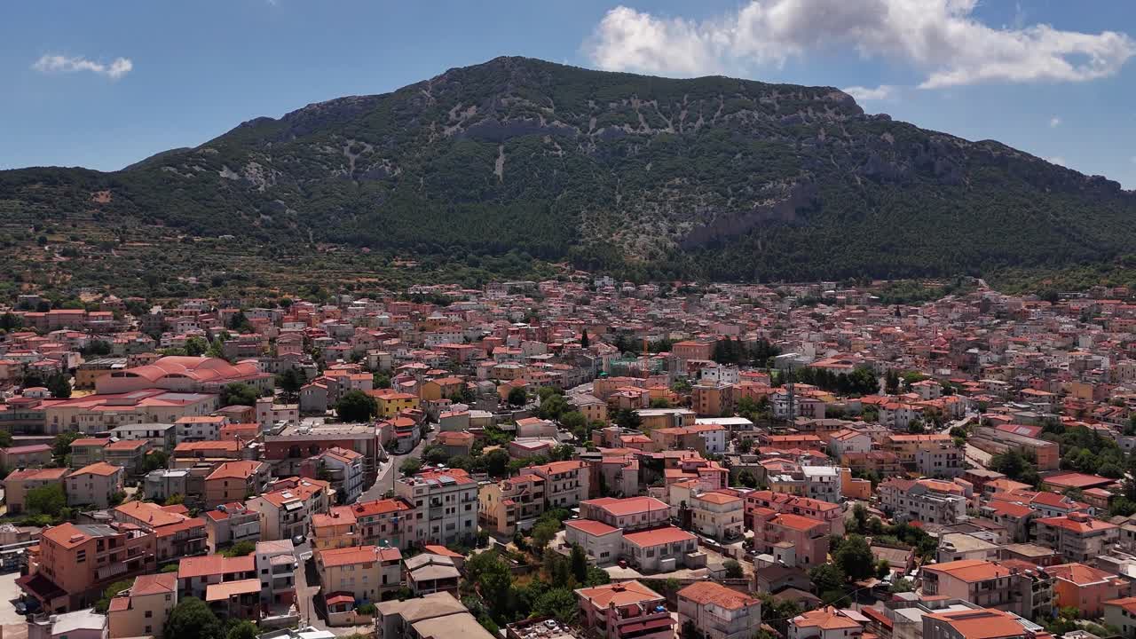 Aerial view of Sarinia Dorgali with mountains and vibrant rooftops
