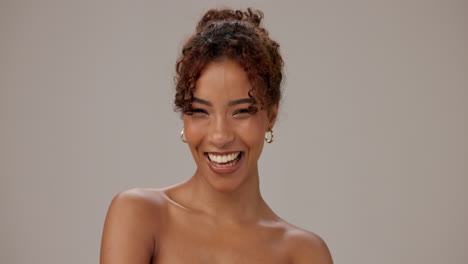 beautiful woman with curly hair smiling
