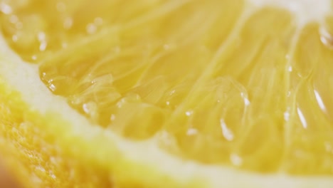 extreme closeup of fresh sliced orange rotating
