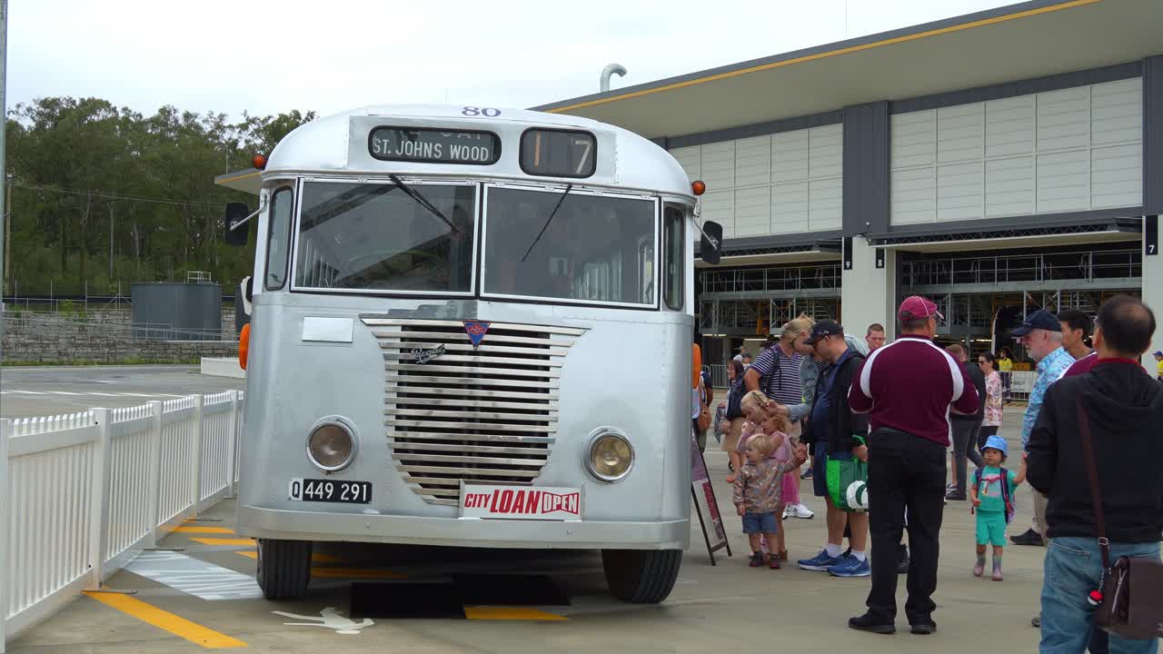 People on board the Heritage Brisbane City Council Bus Fleet, St. Johns Wood, exhibiting at Brisbane Metro Depot's Community Open Day in Rochedale.