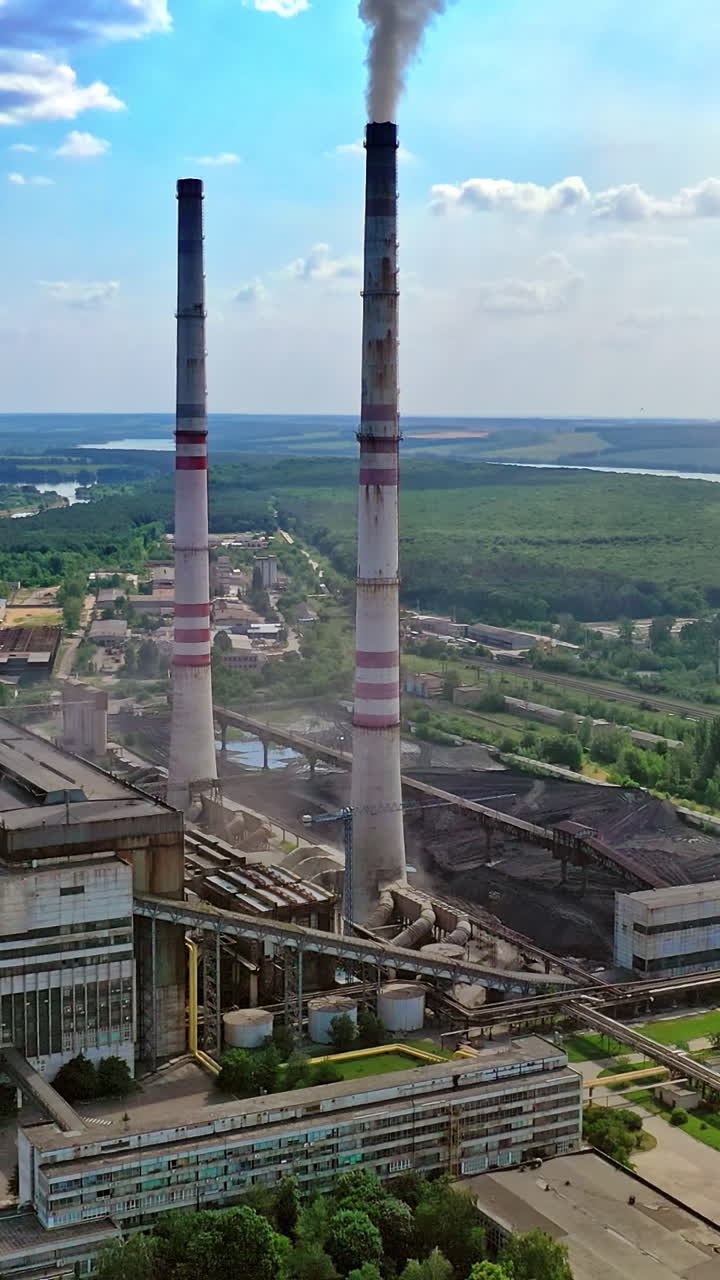 Factory air pollution. Plant emits smoke and smog from the pipes