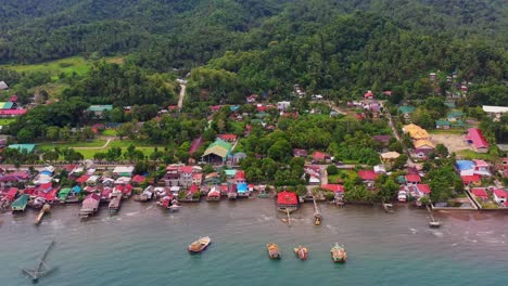 small community of barangay malibago with green forest at the backdrop in saint bernard, southern leyte, philippines