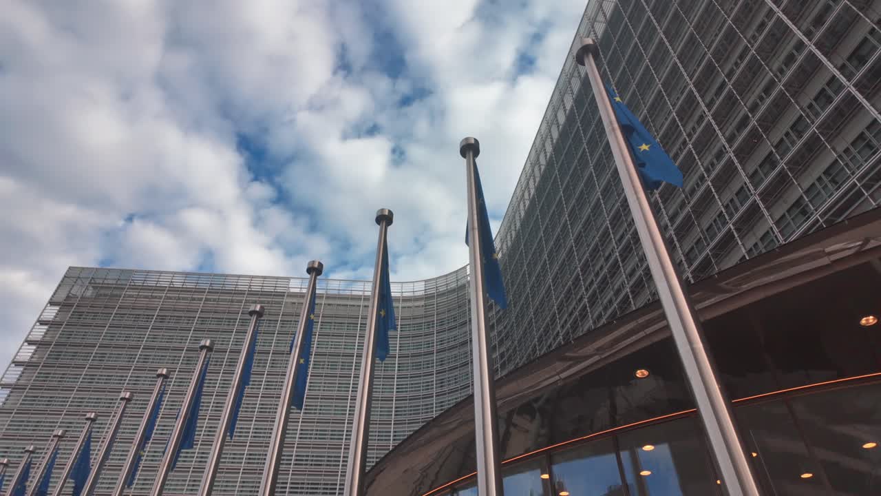 slow motion of EU flags waving at European Commission building