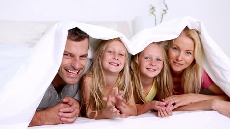 Family-under-a-duvet-