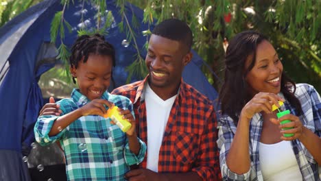 Family-doing-soap-bubbles-with-toys