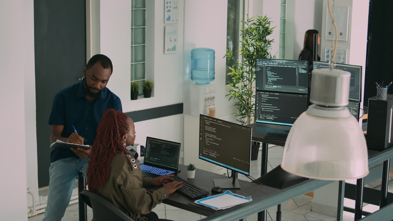 Junior developer working on terminal window to code system script