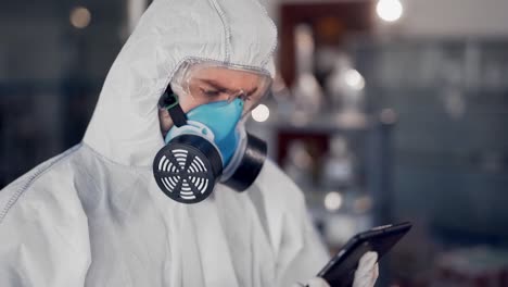 scientist-in-lab-examines-tablet