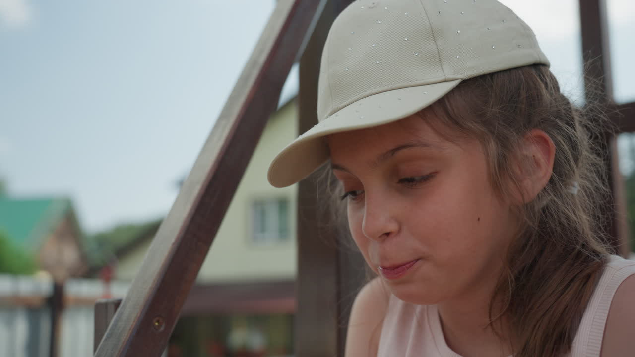 Contemplative Female Stands On Sunlit Staircase, Reflective Girl Looks Thoughtfully On Bright Outdoor Stairs, Serene Young Woman Gazes Peacefully Into Sunlight On Outdoor Staircase Steps