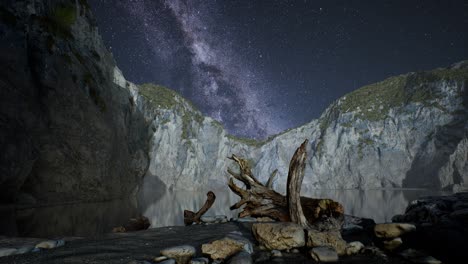 hyperlapse of night starry sky with mountain and ocean beach in lofoten norway