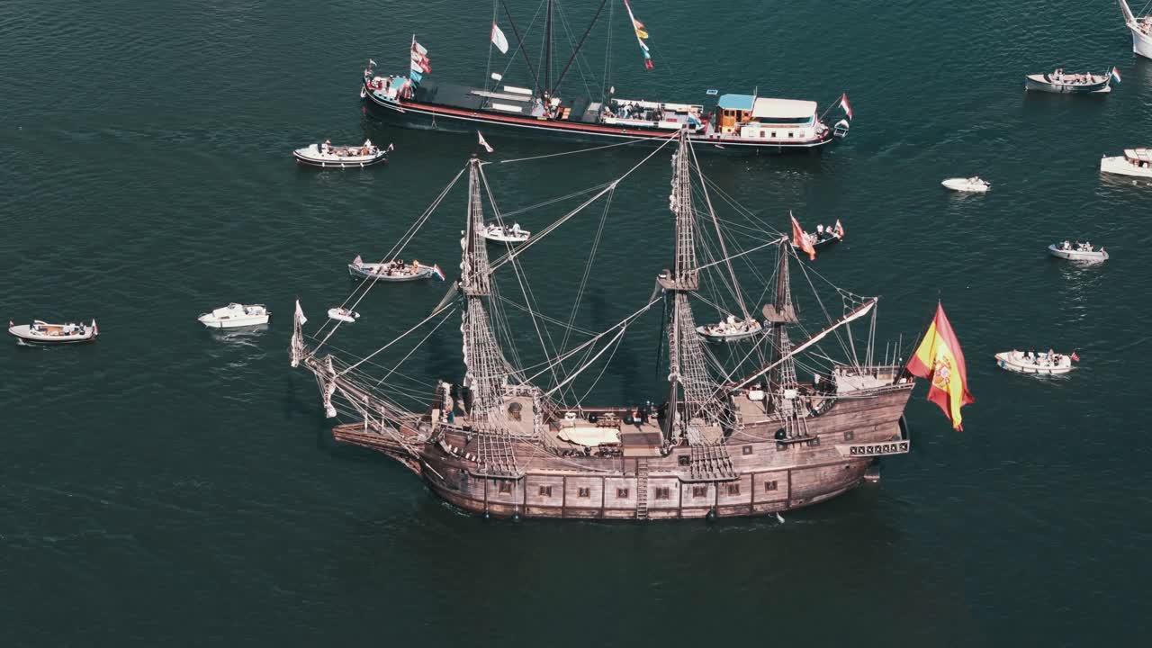 Drone establishing historic Spanish galleon replica during Amsterdam Sail festival in harbor