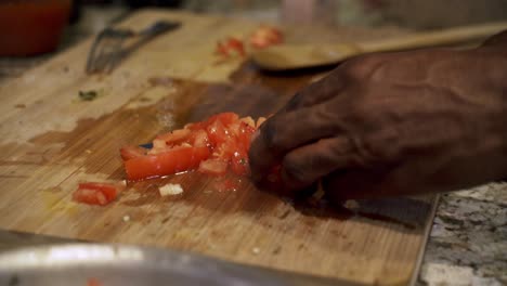 Adding-chopped-tomatoes-to-pan-of-beyond-meatballs-Preparing-ingredients-to-make-vegan-beyond-meatballs-with-spaghetti-and-meat-sauce