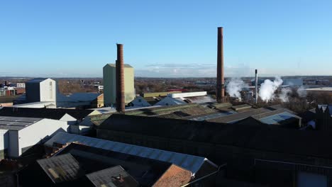 pilkington glass factory warehouse buildings aerial view lowering over industrial town manufacturing facility