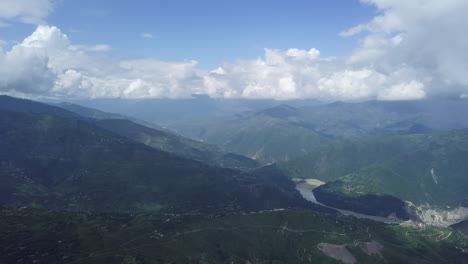 mountain valley landscape with river and clouds