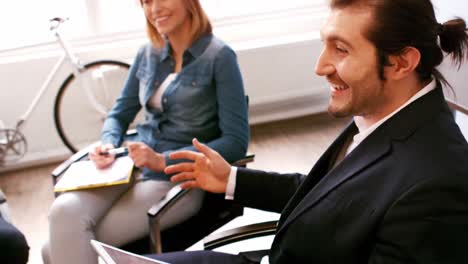 Business-executives-having-discussion-in-conference-room