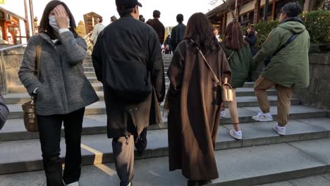 crowds exploring a traditional japanese temple