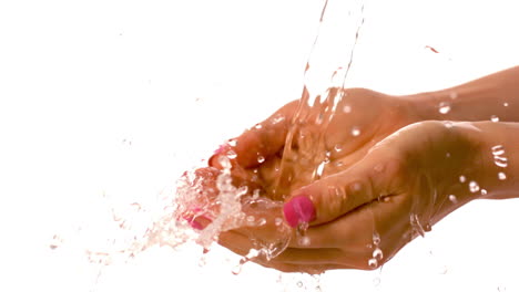 Water-pouring-over-female-hands