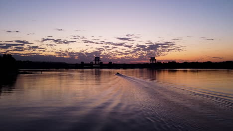 sunrise over a dam and river