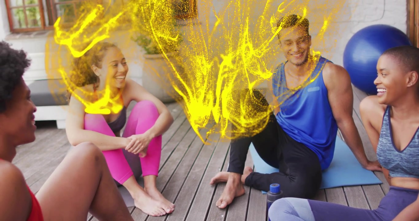 Amici seduti su tappetini che parlano di benessere, avviando vortici gialli luminosi sopra un cerchio.