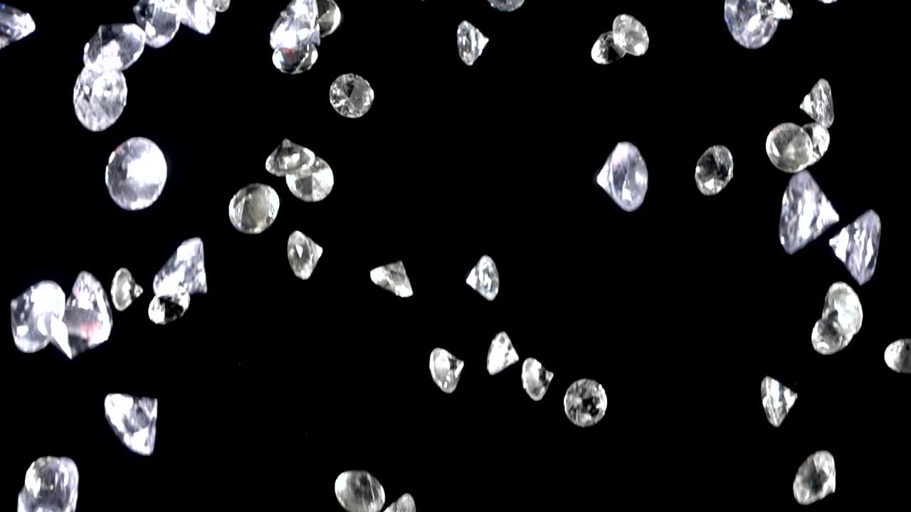 어두운 배경 위에 천천히 떨어지는 다이아몬드