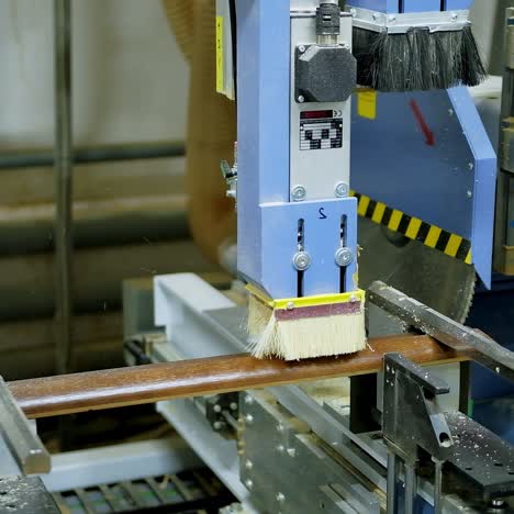 manufacture of doors. industrial equipment for making furniture. automated machine tool in doors production plant. close-up.