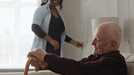elderly man being cared for by a caregiver at home