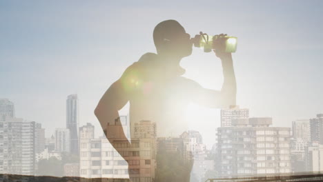 animation of glowing lights over an exercising african american man drinking water