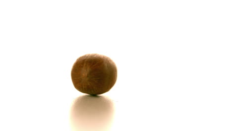 nut spinning on white surface