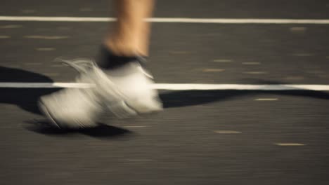 athlete's feet running in a sprint in the evening