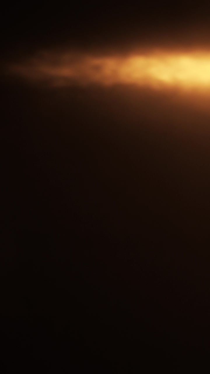 Abstract Golden Light Leaks and Flares on Dark Background