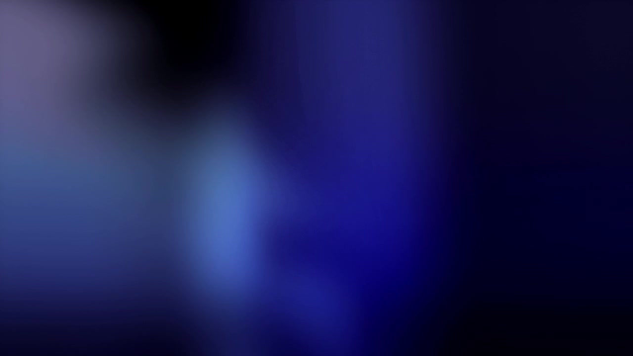 Abstract Blue and Purple Light Leaks on Black Background
