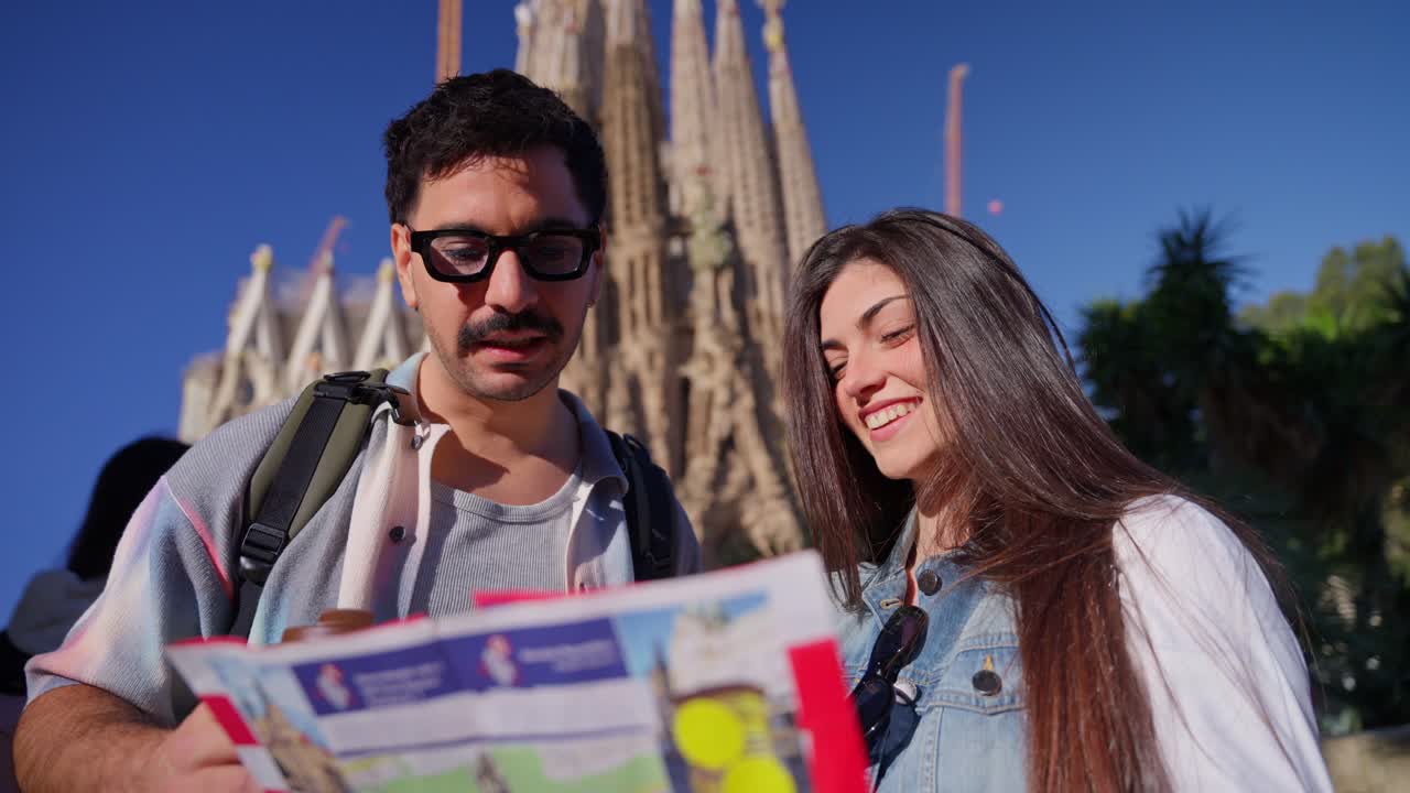 Happy Couple Tourists Looking at Map and Phone in City