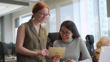 women discussing office project