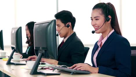 business people wearing headset working in office