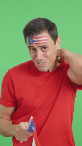 Man cheering for Puerto Rico during a match that is lost