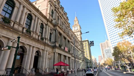 tram moving past melbourne's historic gpo building