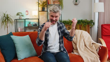 happy rich mature middle-aged man showing wasting or throwing money around hand gesture more tips