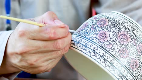 detailed hand-painting of a decorative bowl